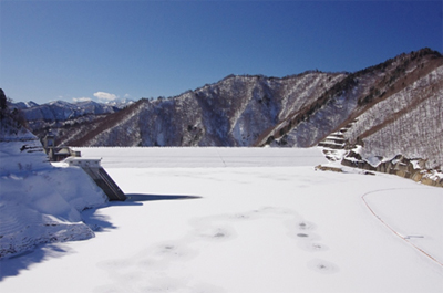 Reservoir of Naramata Dam covered with snow and intake tower